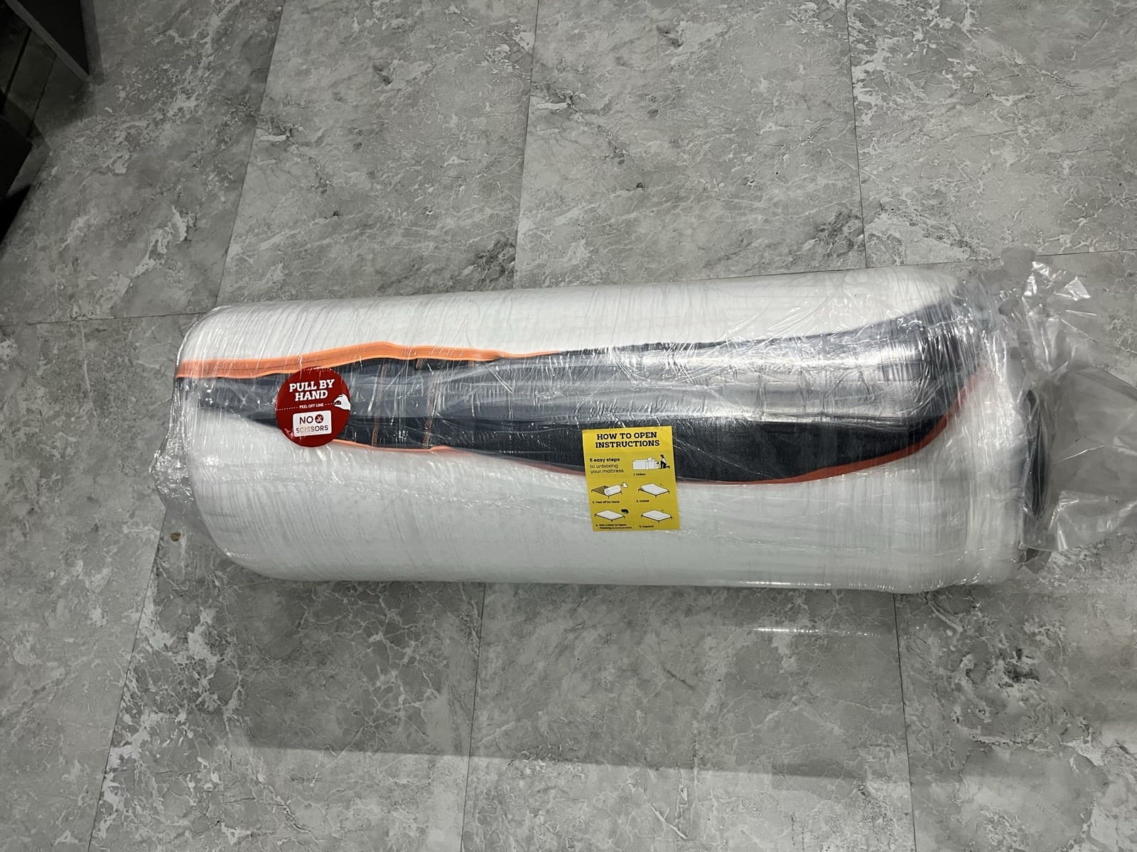 The Emma Performance rolled and vacuum-sealed in plastic on the floor, before it expanded.